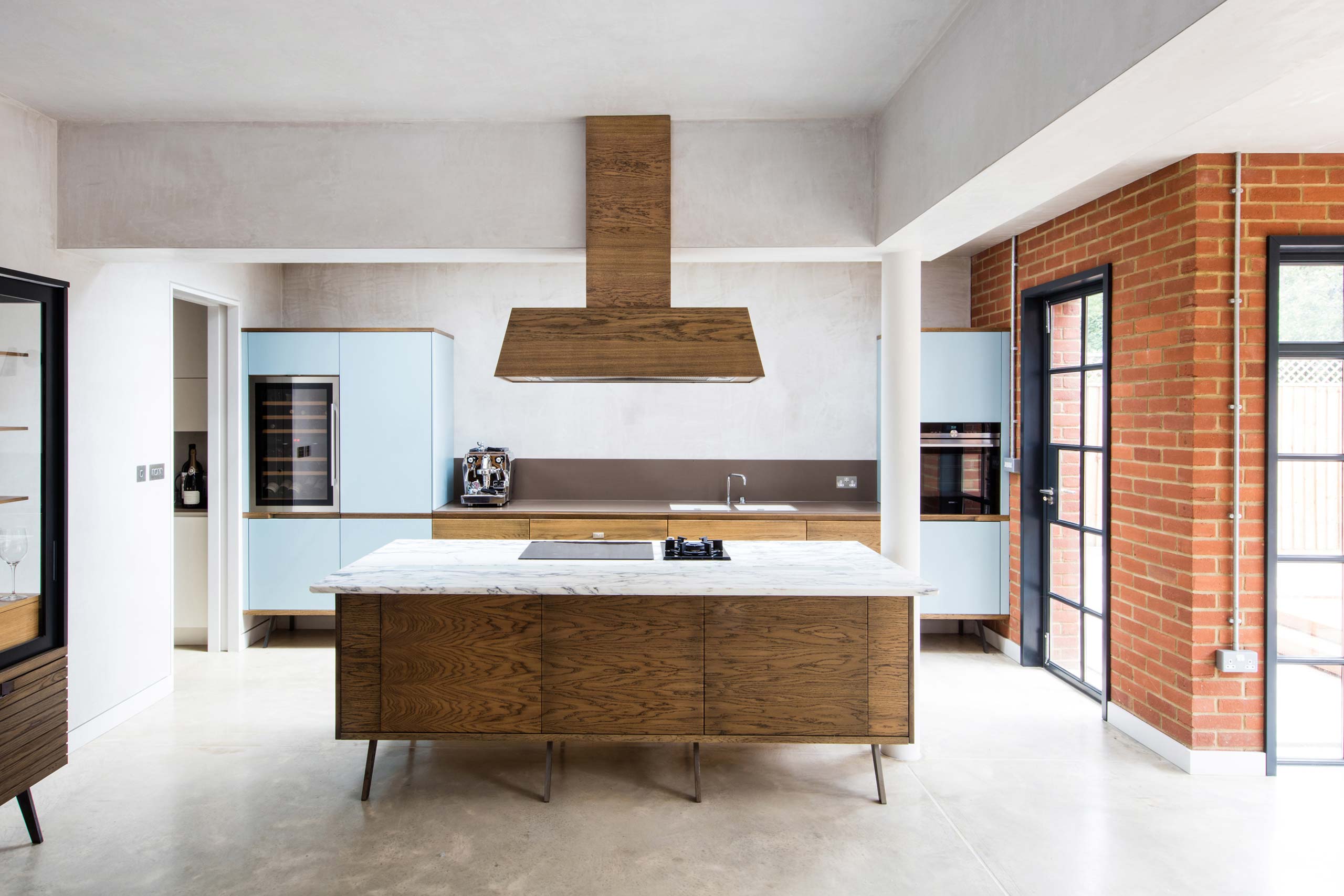 Handmade fumed oak corian kitchen with marble island unit by Six Hands