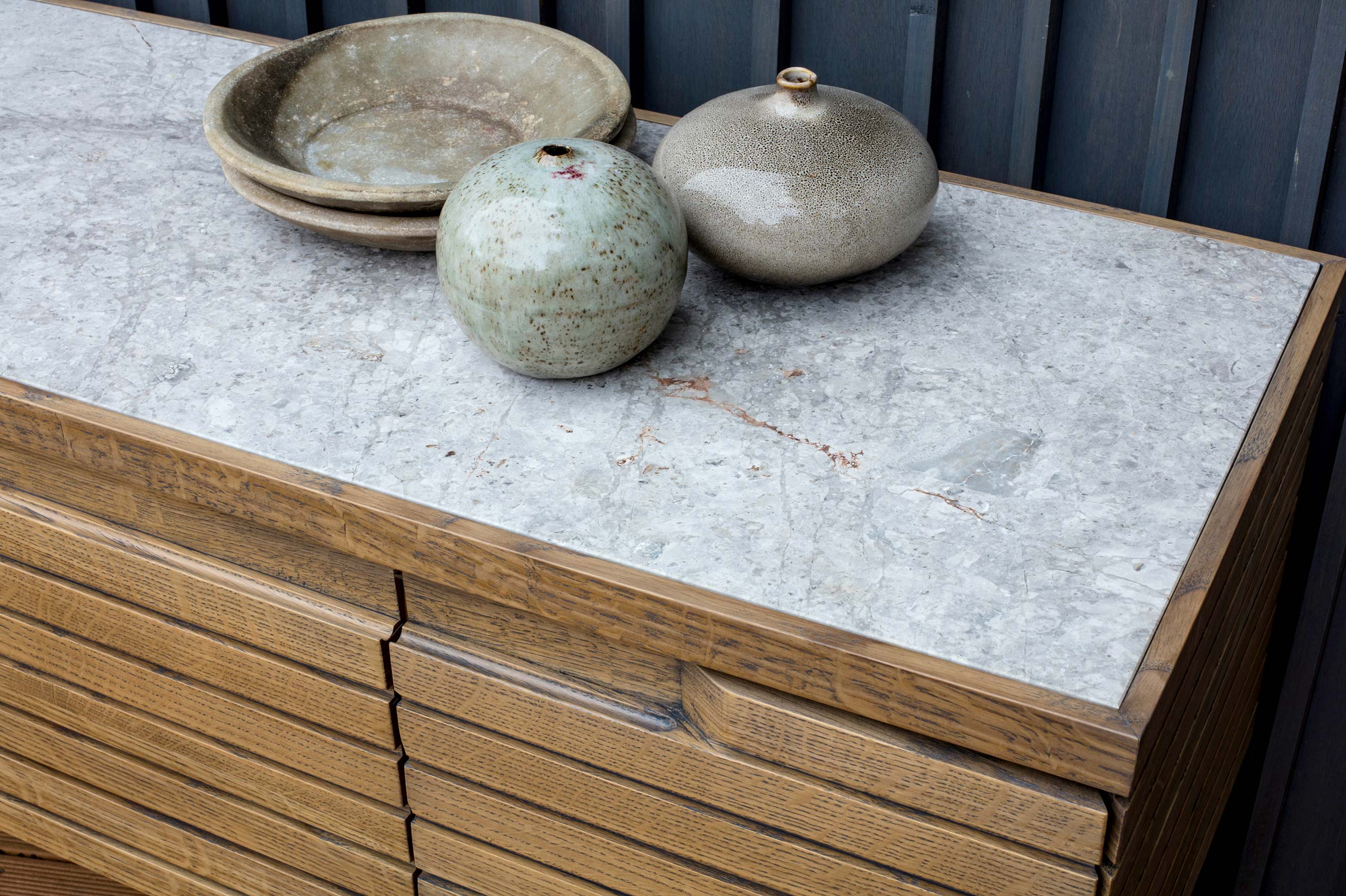 Detail of oak sideboard with marble top by Six Hands