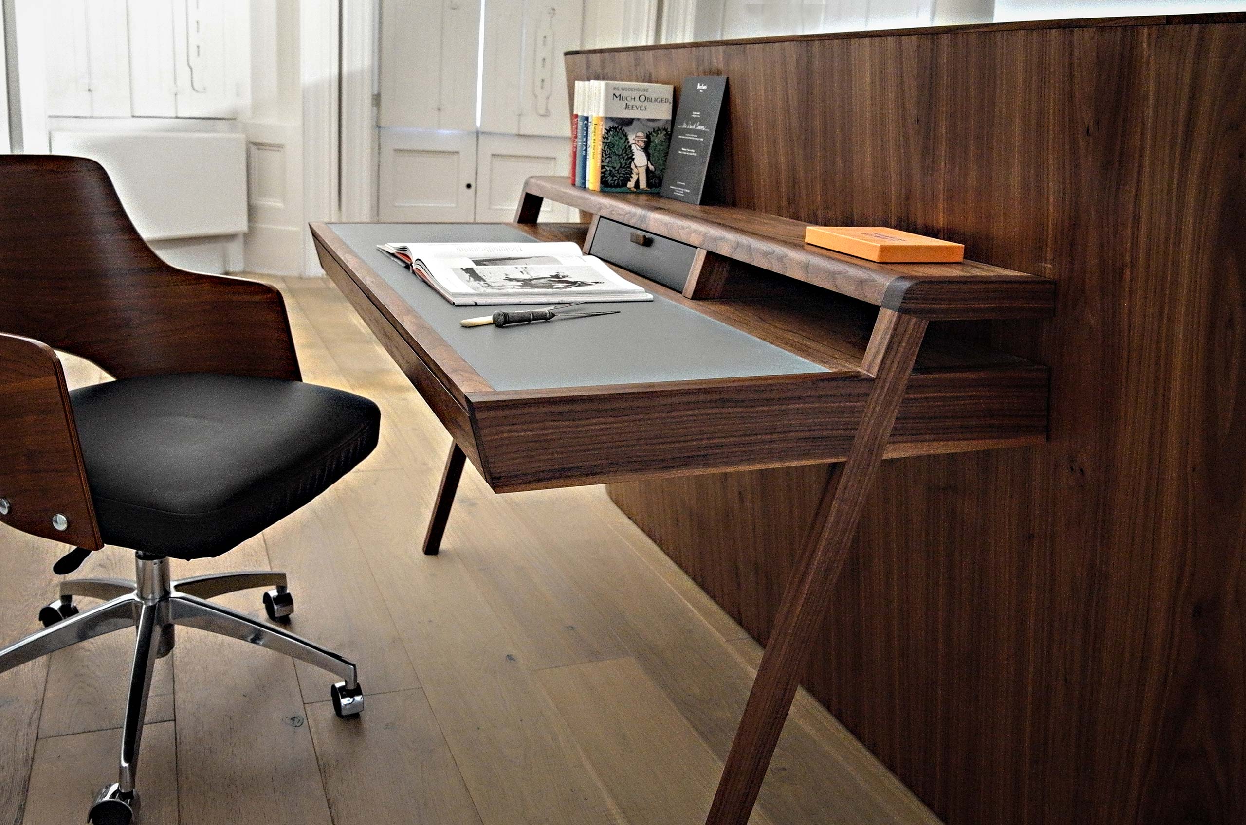 Bespoke walnut bed with integrated desk by Six Hands
