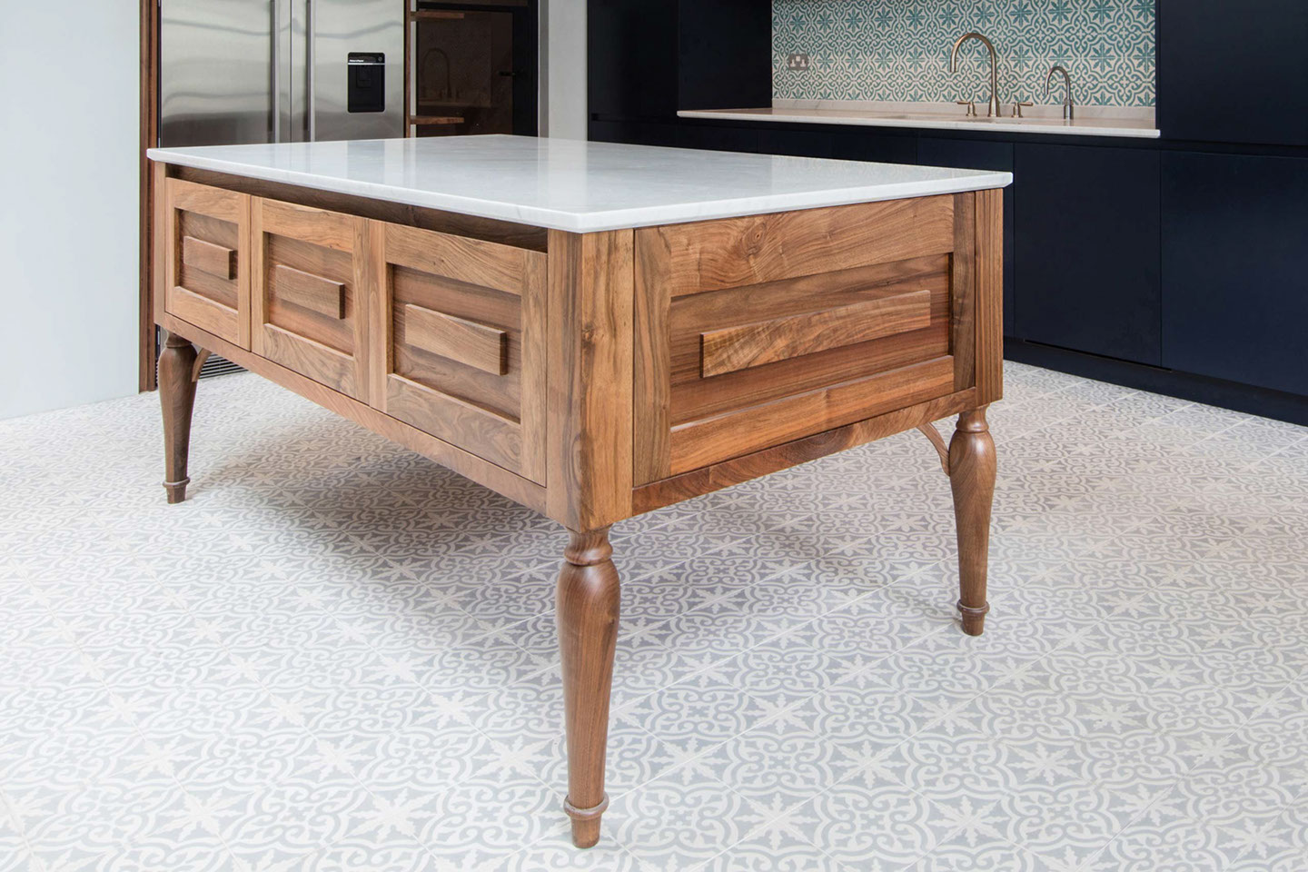 Bespoke navy blue kitchen with walnut and marble island unit by Six Hands
