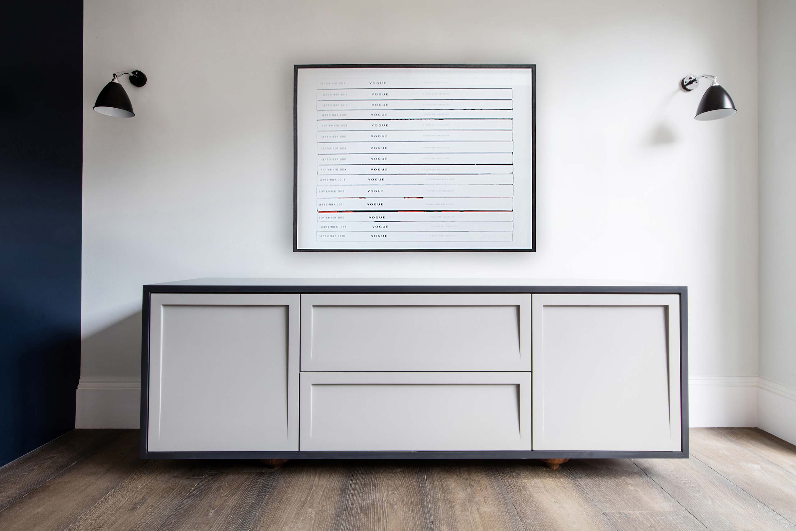Bespoke corian sideboard with turned walnut legs by Six Hands